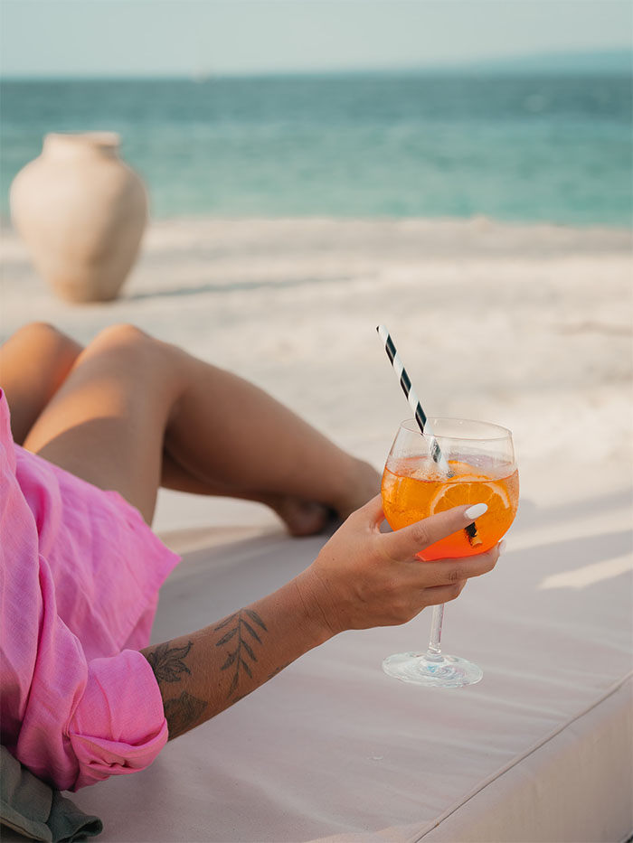 Relaxing on a sunbed with a drink at Bahia Gili Air beach