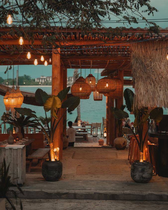 The inviting open-air entrance of BAHIA, a premium beachfront barbecue restaurant on Gili Air overlooking the ocean.