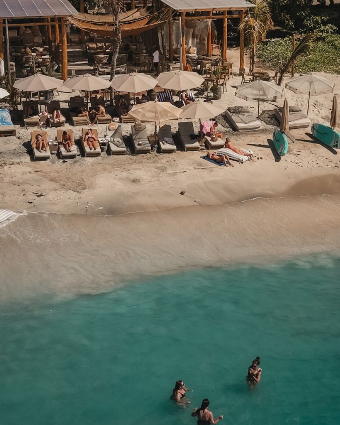 Sunbeds and seating along Bahia's beachfront restaurant in Gili Air