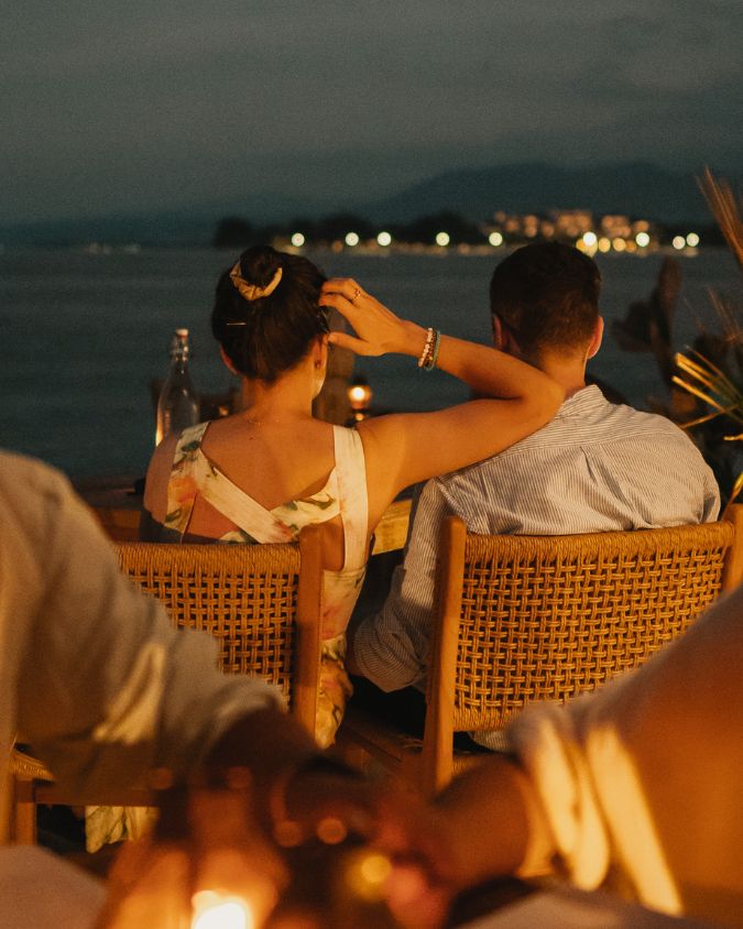 Couple enjoying a romantic dinner at Bahia during blue hour